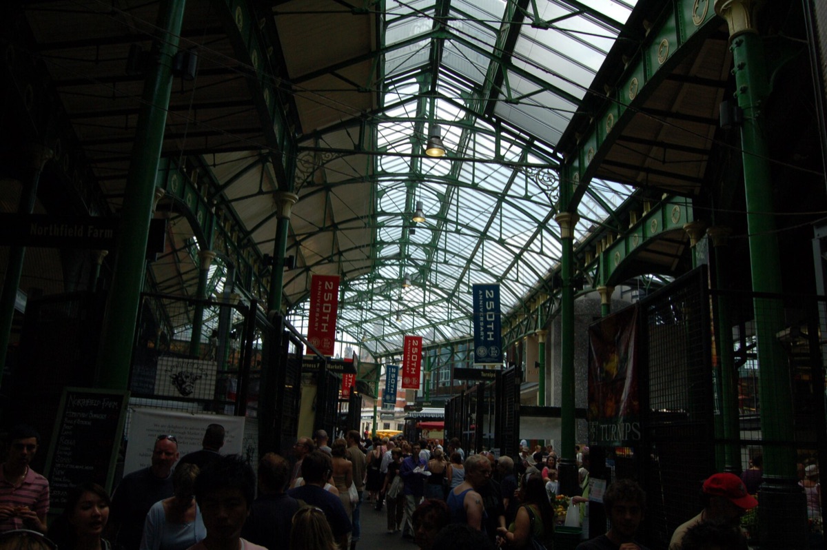 Produce stalls under the Victorian roof of Borough Market