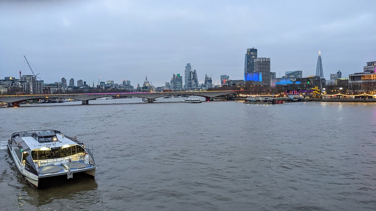 An Uber Boat by Thames Clippers on the river